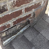Rusted and leaking chimney flashing.
